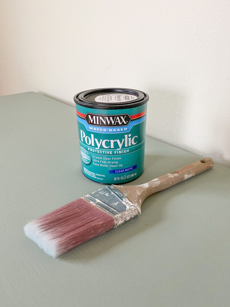 Applying polycrylic to the finished console table
