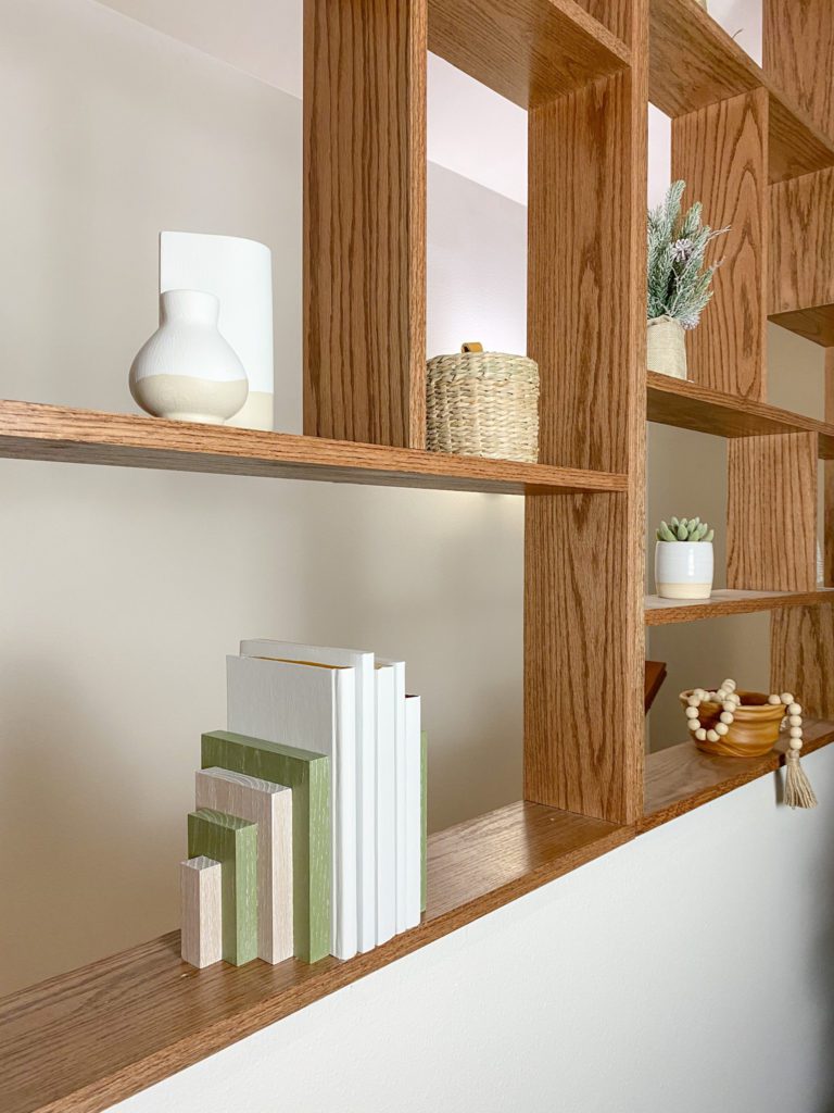 Finished modern bookends on pony wall shelving