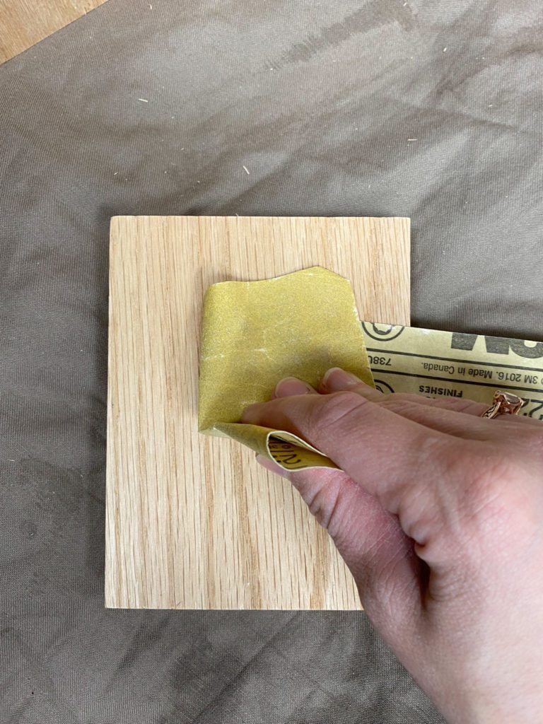 Sanding wood with 220 grit sandpaper