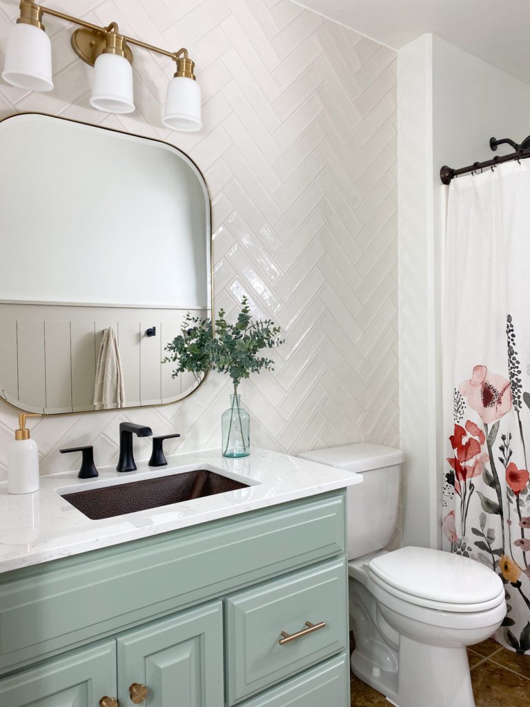 Beautiful white and green bathroom reveal with floral accents