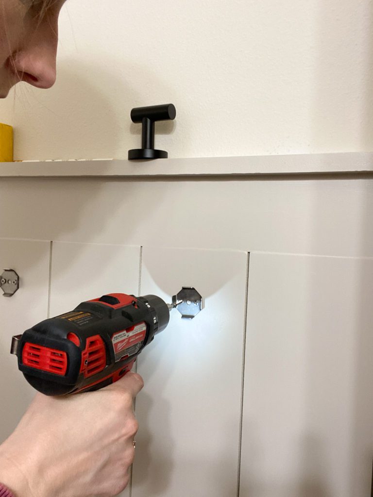 installing towel hooks on shiplap
