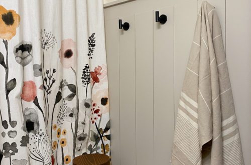Finished Vertical Shiplap Wall in Bathroom with Floral Curtain