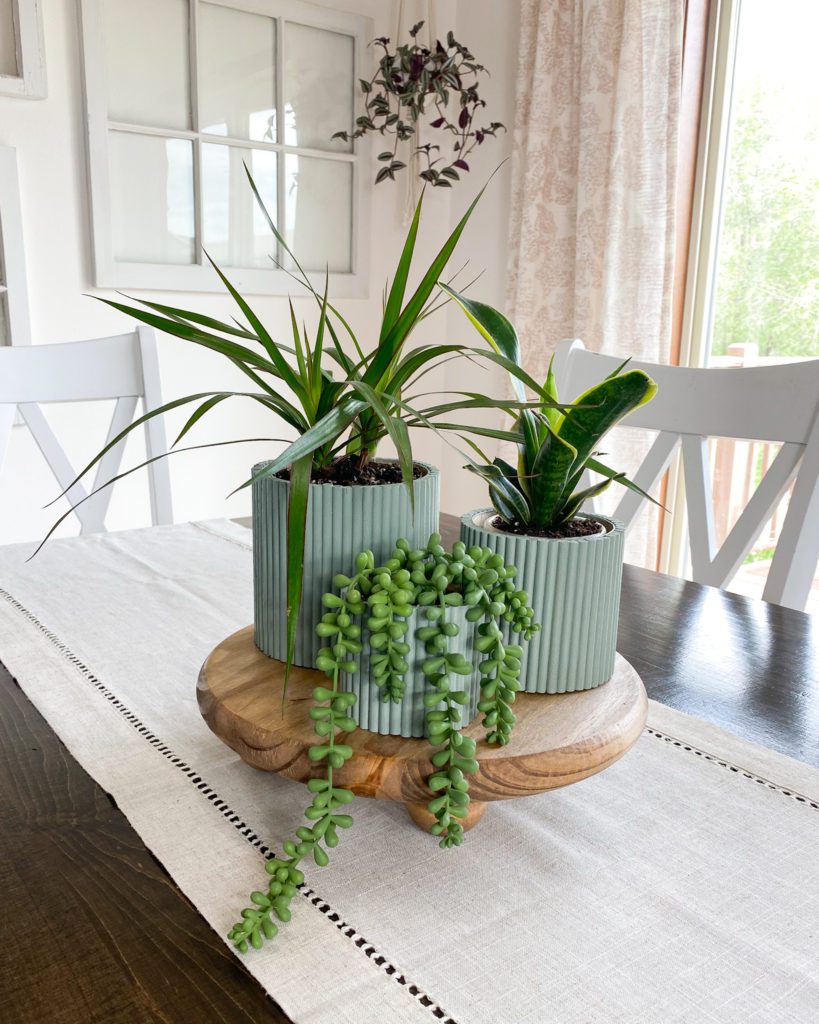 Completed plant riser and 3 DIY dowel planters